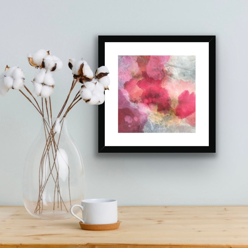 BLUSH print displayed in a black frame in interior