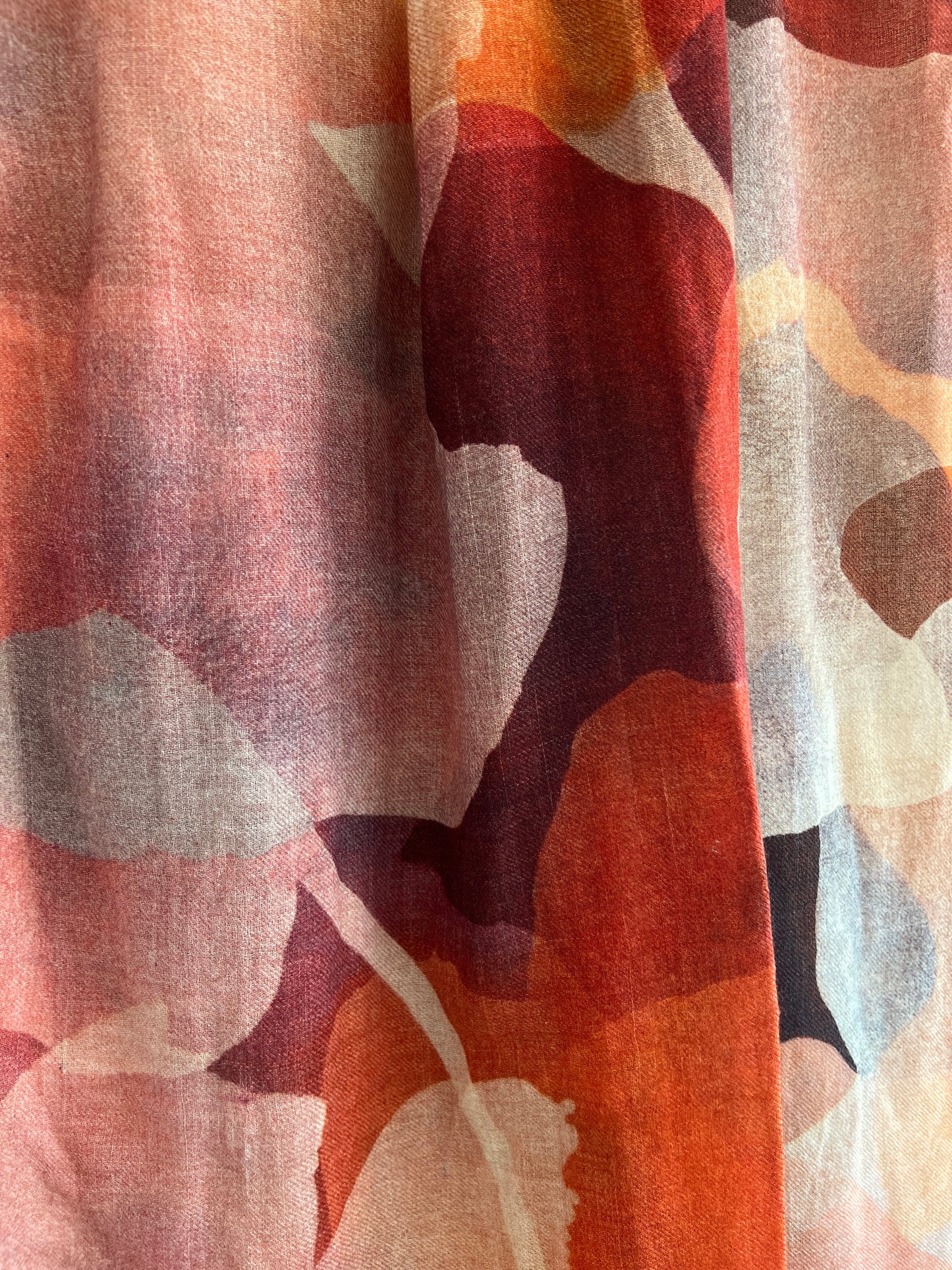 Close-up of art scarf with a multicolored abstract pattern