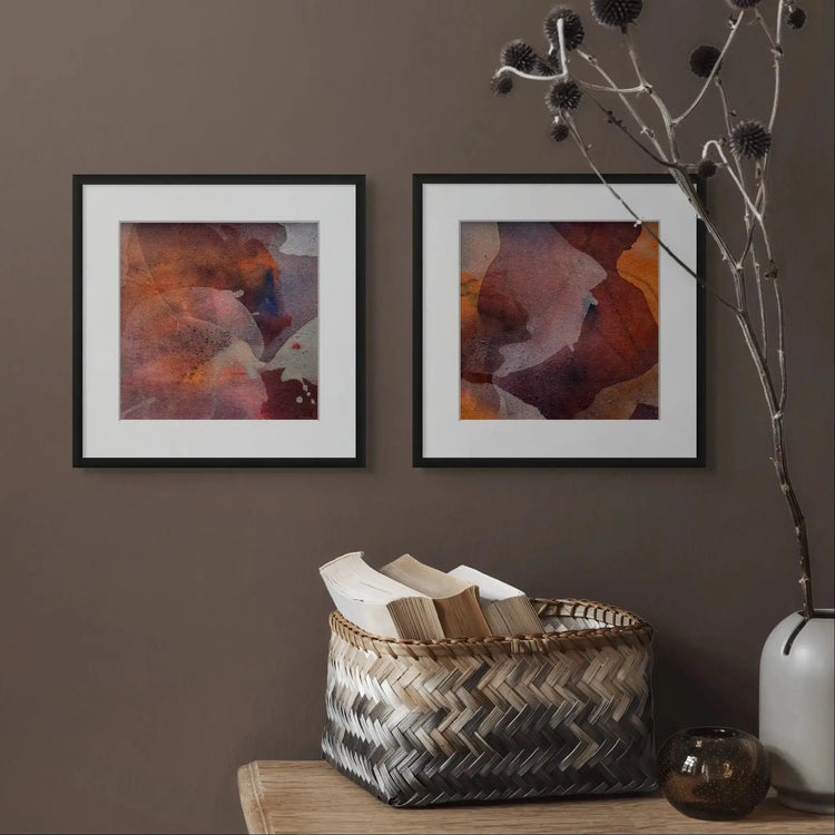 To small originals by Ida Kopperud, hanging on a dark wall