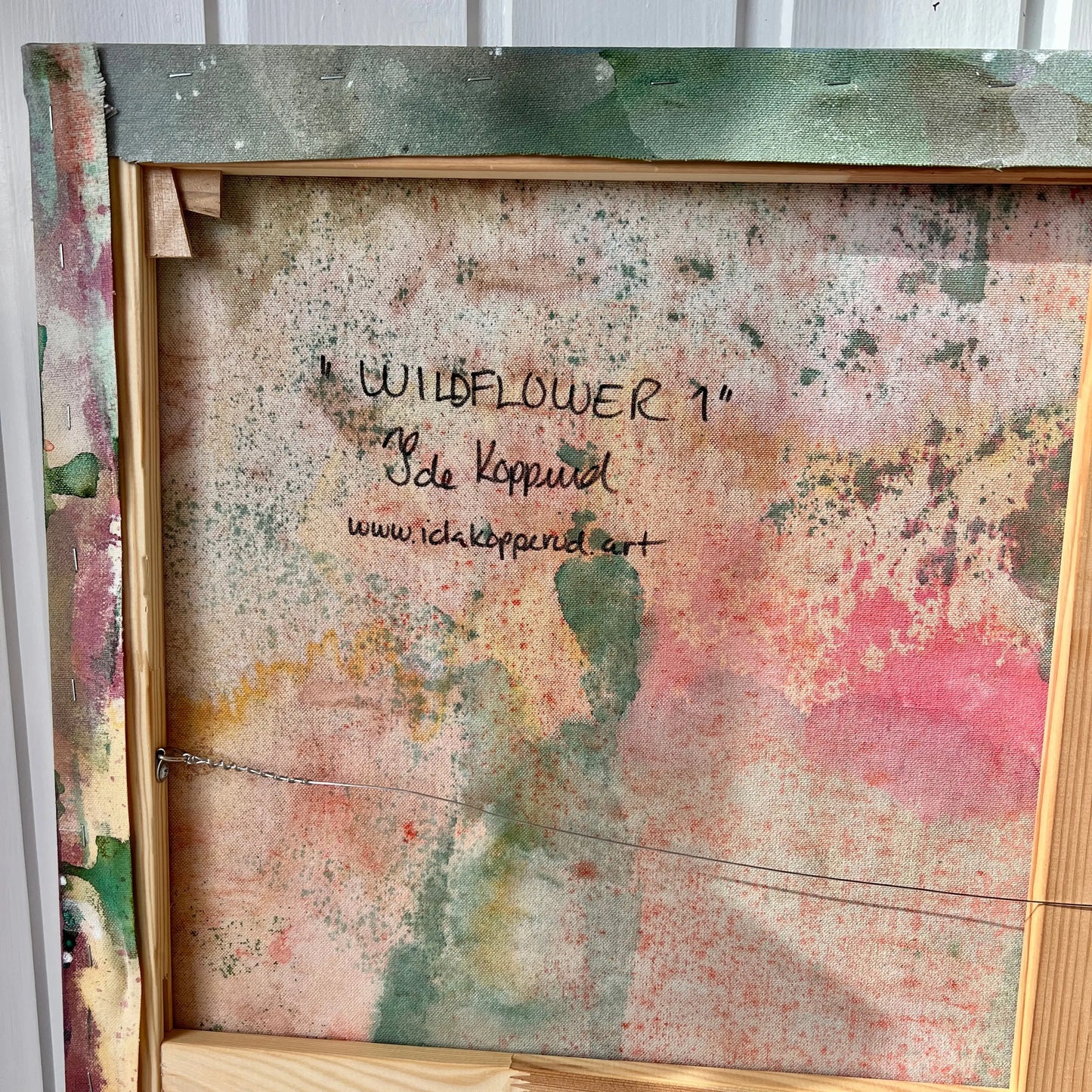 The back of WILDFLOWER 1, original abstract painting by Ida Kopperud