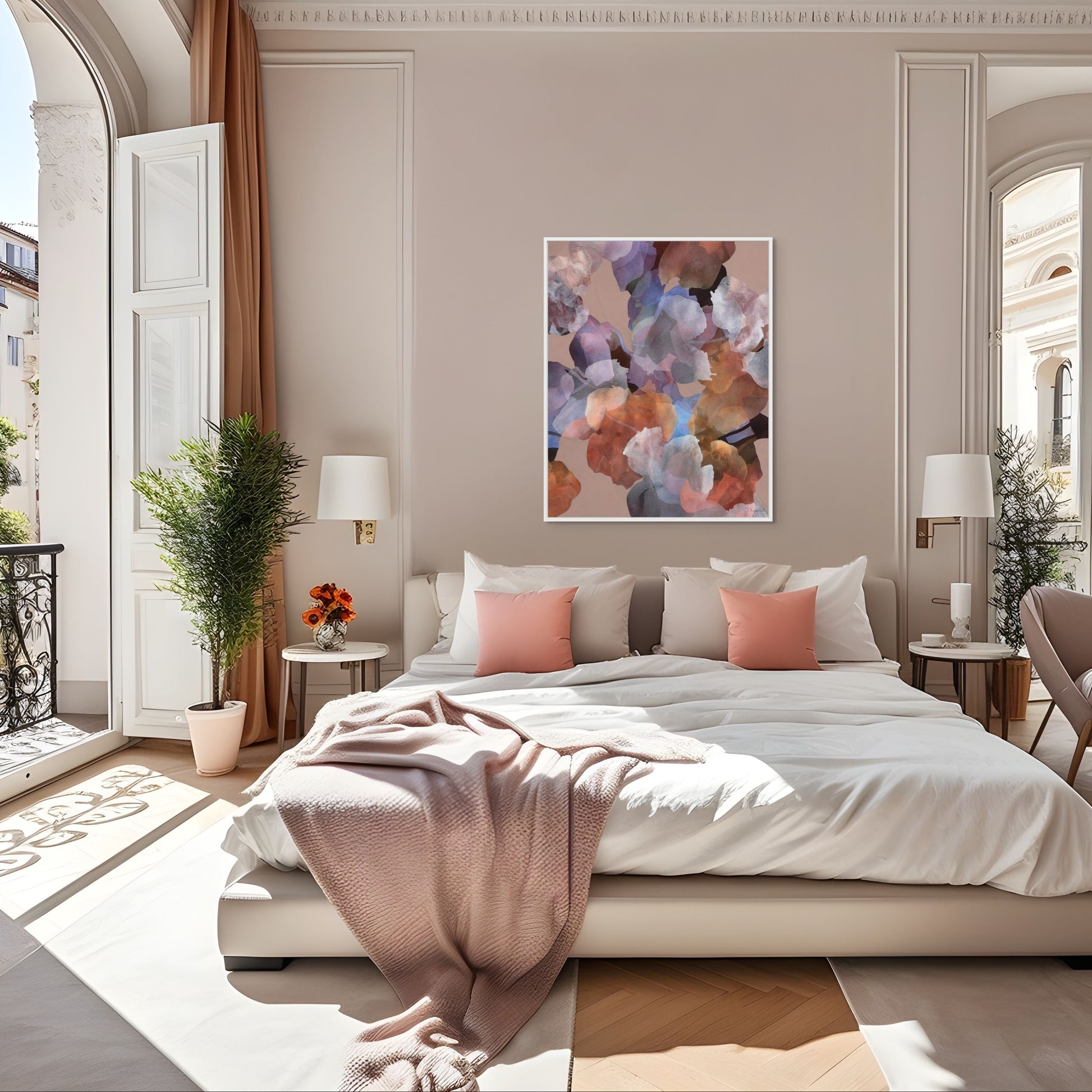 Floral print with white frame above a large bed in luxurious bedroom