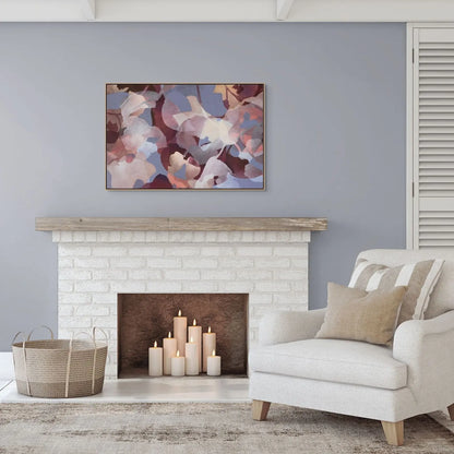 Living room with a fireplace, armchair, and abstract painting on a gray wall.
