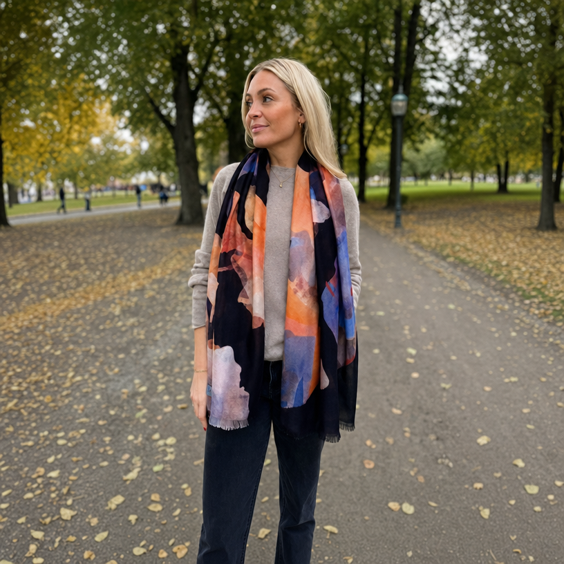 Woman wearing a colorful scarf in a park setting