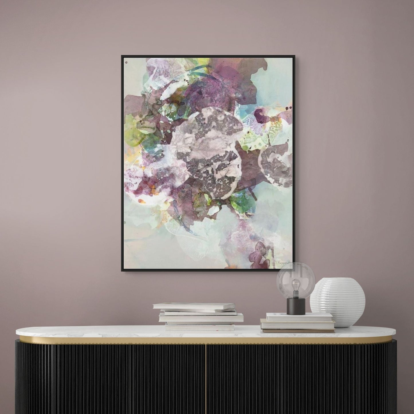 Modern interior with a black and gold sideboard, white lamp, and abstract art on a purple wall.