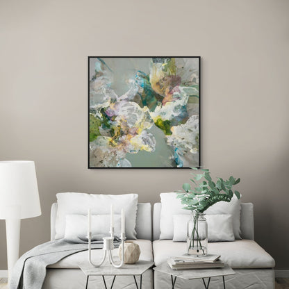 Living room with a white sofa, abstract floral painting, and decorative items.