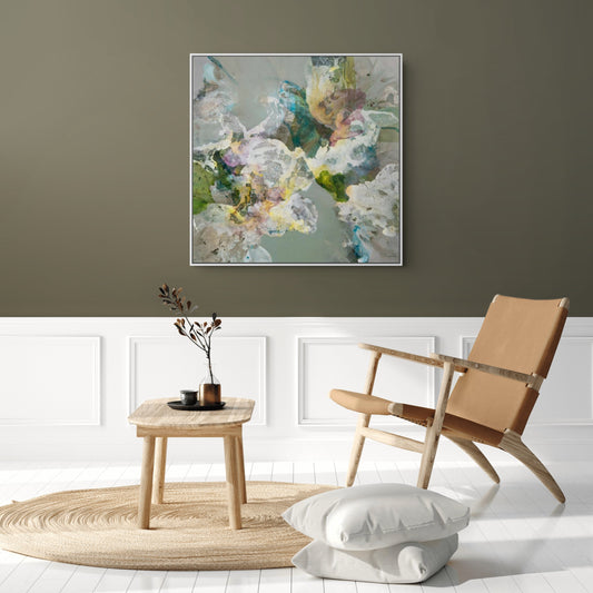 Living room with abstract art on the wall, wooden chair, and small table.