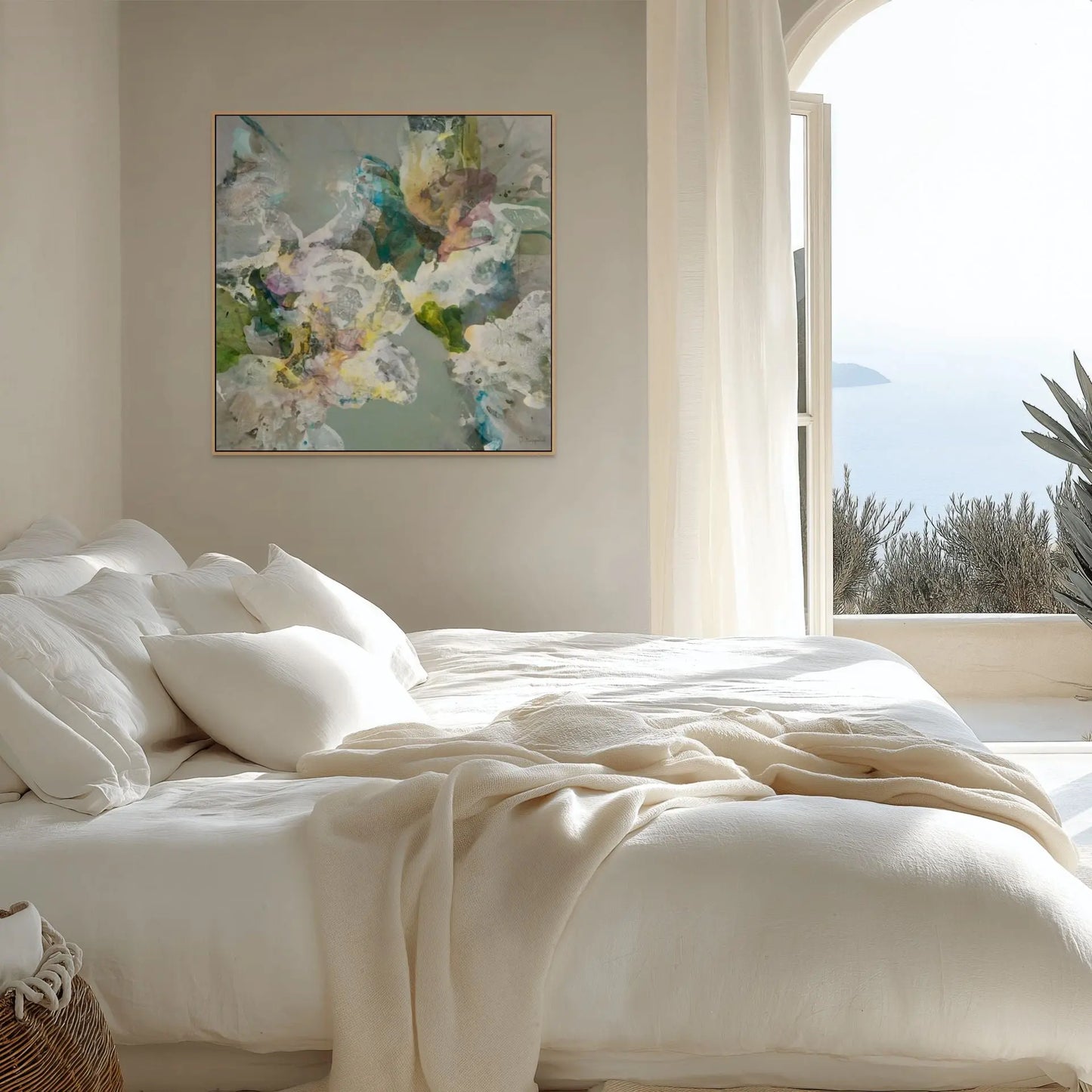 Neatly made bed with white bedding in a bright bedroom with abstract art on the wall.
