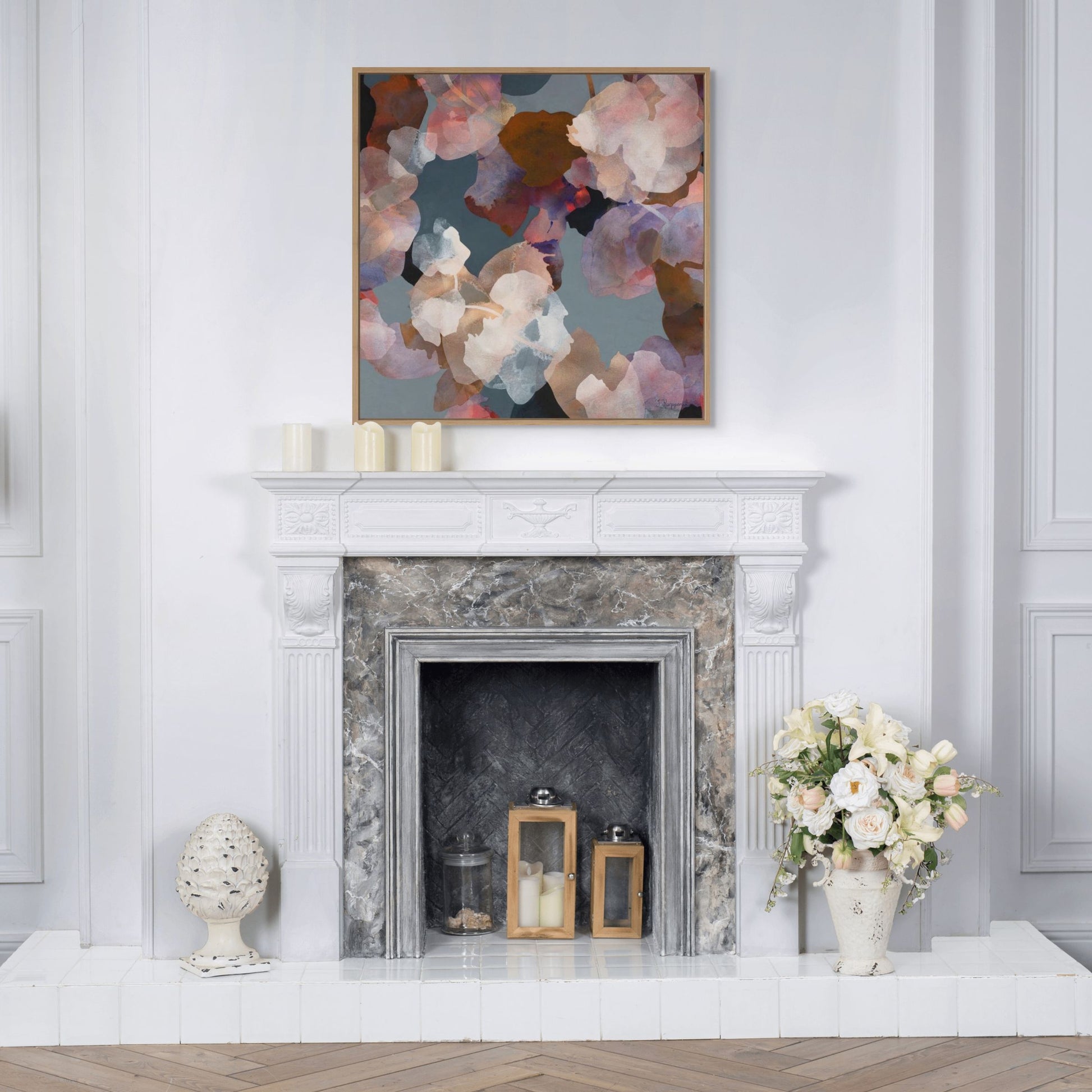 Living room with marble fireplace, floral artwork, and decorative items.