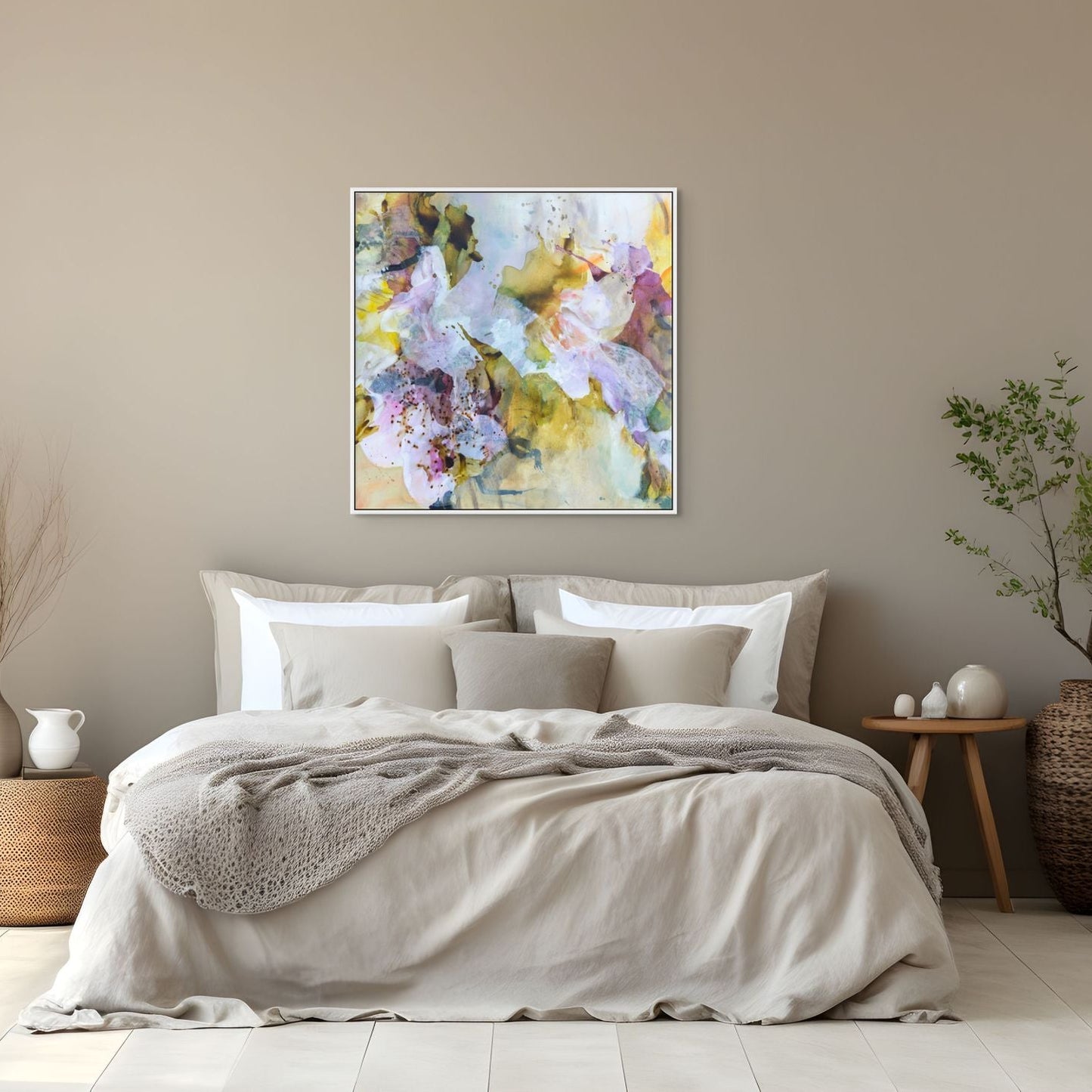 Bedroom with floral artwork on the wall, bed with beige bedding, and decorative items.