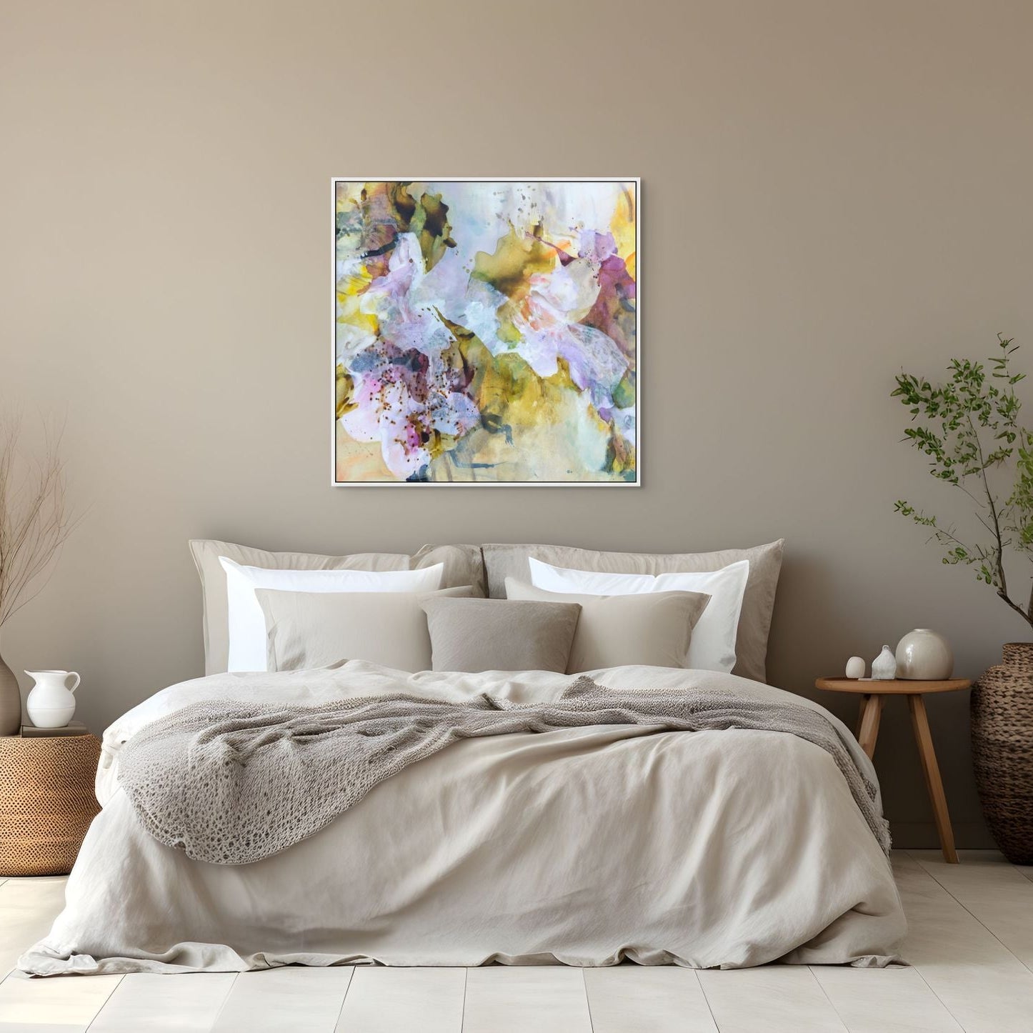 Bedroom with floral artwork on the wall, bed with beige bedding, and decorative items.