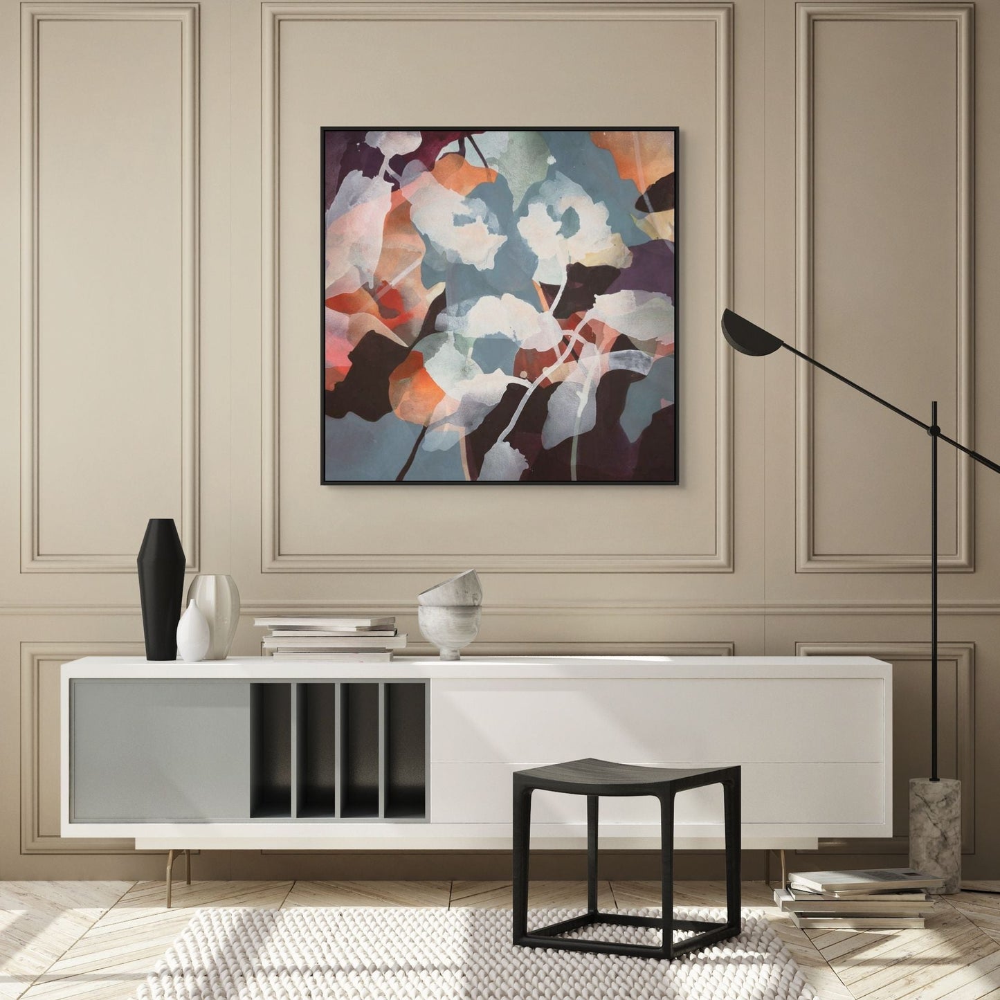 Modern interior with a white console table, abstract painting, and decorative items.