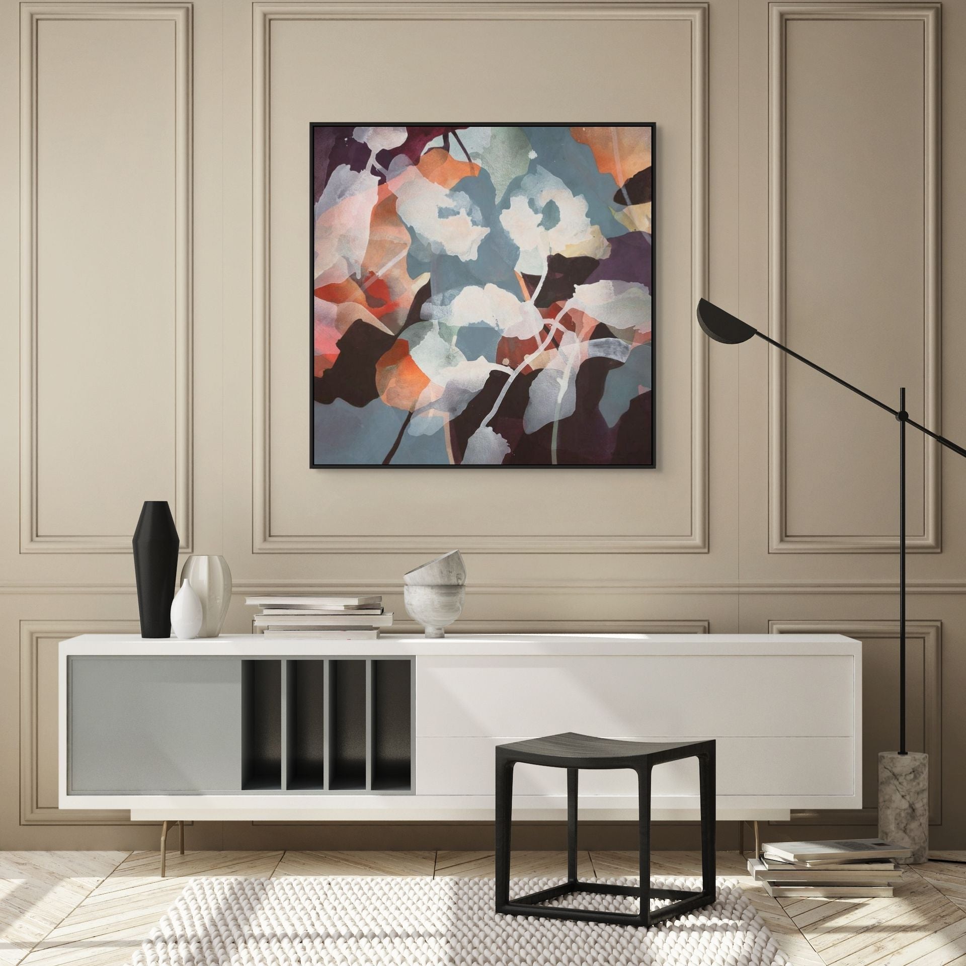 Modern interior with a white console table, abstract painting, and decorative items.